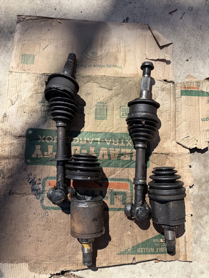 Pair of CV axles removed and laid out during drivetrain service