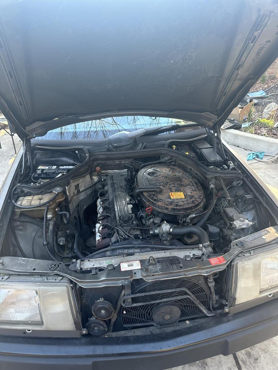 Mercedes-Benz engine bay wide open during full engine diagnostics and repair
