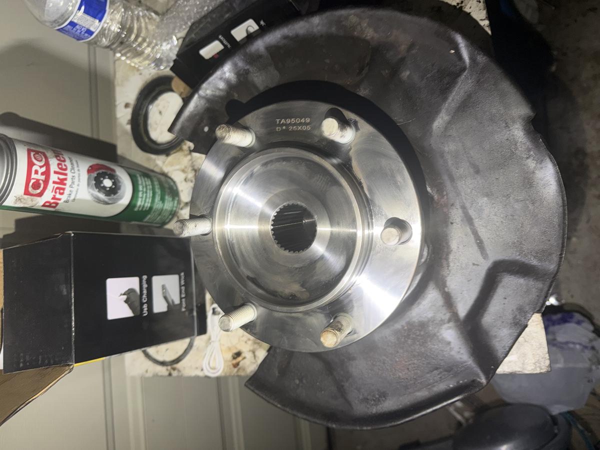 Brand new wheel hub and bearing assembly ready for installation with CRC Brakleen