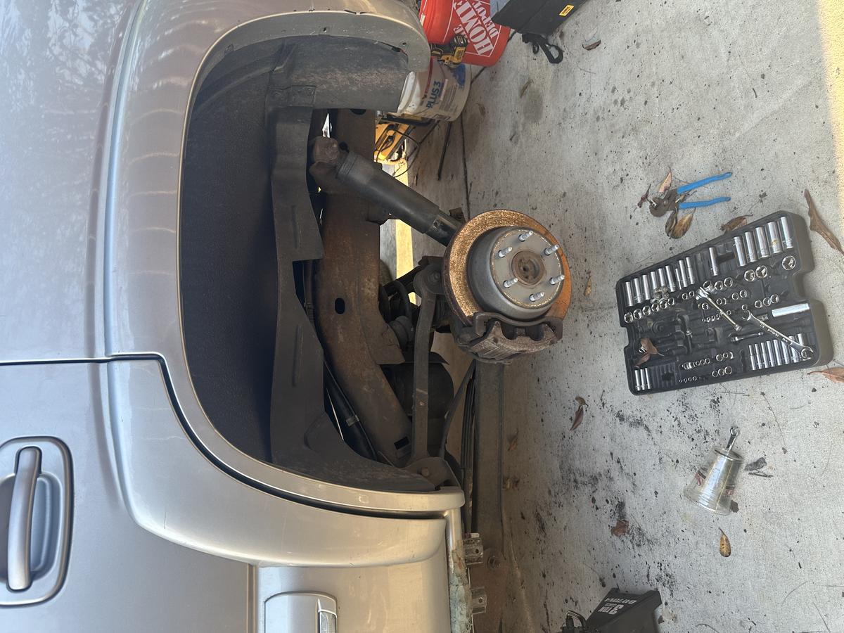 Front suspension disassembled during hub and brake rotor service